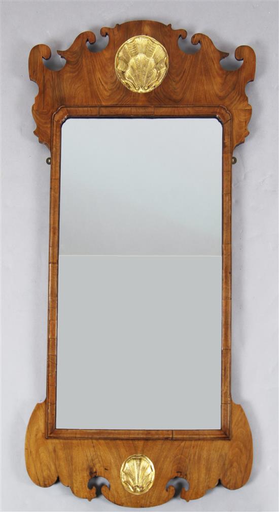 An early 18th century walnut fret frame wall mirror, W.2ft 4in. H.4ft 5in.